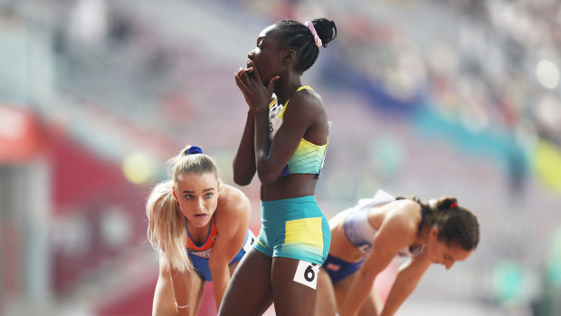 Bendere Oboya (centre) after her heat in the 400m.