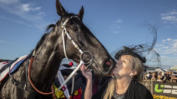 My baby: Mary Jane Basson gives Derby winner Dark Dream a kiss.