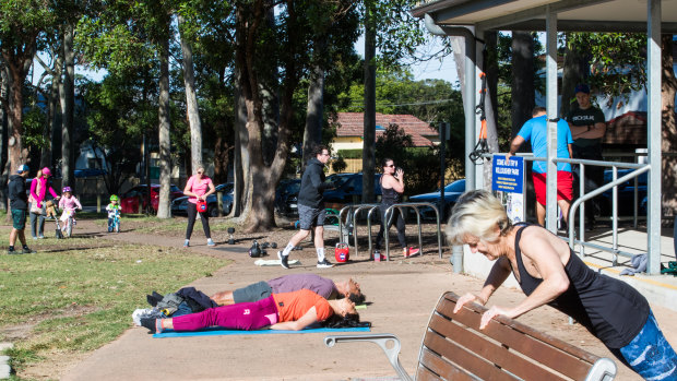 People exercising in Willoughby Park, resisting the urge to be sedentary during the COVID-19 crisis.