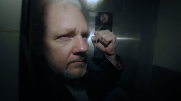 WikiLeaks founder Julian Assange being taken from court in May.