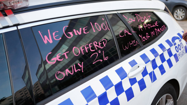  Messages on police cars in North Melbourne. 