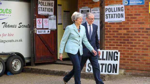 British PM Theresa May and Philip May, her husband, departing after casting their votes in the European Parliamentary elections on Thursday.
