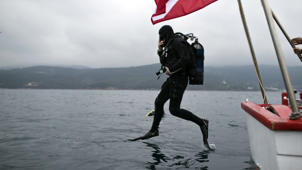 Lead archaeologist Dimitris Kourkoumelis dives to the shipwreck.