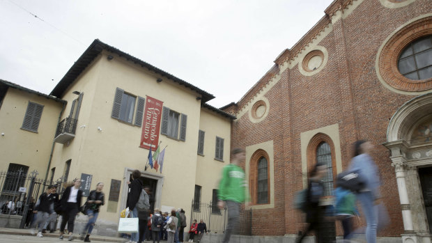 Visitors walk outside the ''Last Supper, Cenacolo'' museum in Milan on the 500th anniversary of Leonardo da Vinci's death, in Milan.