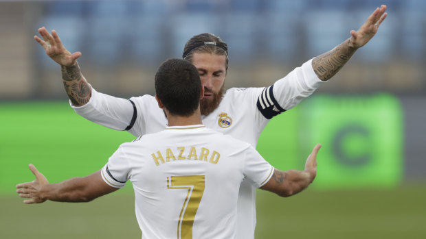 Ramos celebrates with Eden Hazard during the 3-1 victory.