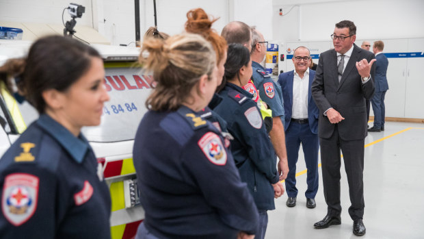 Premier Daniel Andrews with paramedics on Thursday.