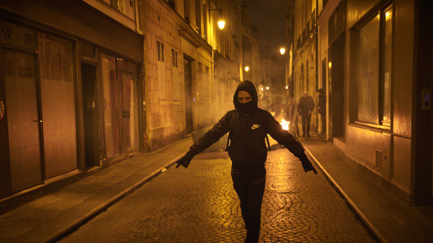 A protester walks the streets of Paris.