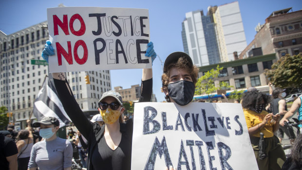 Demonstrators rally for George Floyd in the Harlem neighbourhood of New York.