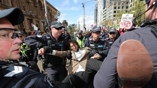 A protester is arrested at the Extinction Rebellion Spring Street protest.