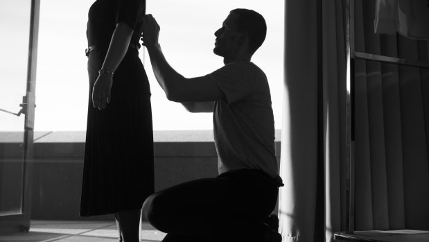 Dion Lee fine-tunes the Opera House uniforms using a staff member as his model.