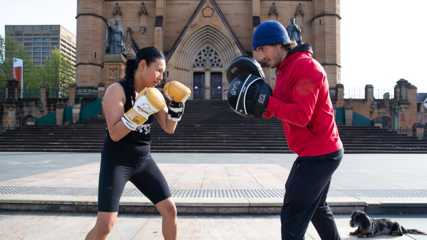 Kylie Javier Ashton training with personal trainer Ben Savva in front of St Mary’s Cathedral.