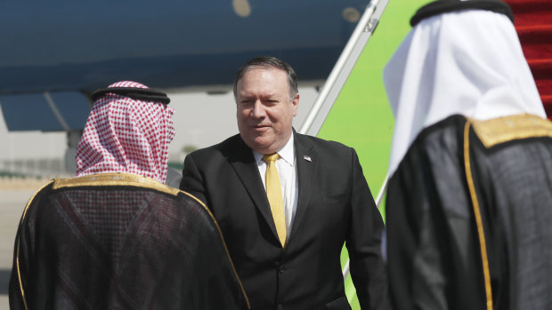 US Secretary of State Mike Pompeo, centre, is greeted by Saudi Foreign Minister Adel al-Jubeir after arriving in Riyadh for urgent talks on Tuesday.