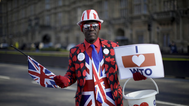 Leave the European Union supporter Joseph Afrane, aged 55 from London and originally from Ghana, poses for photographs outside the Houses of Parliament in London.