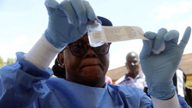 A health worker prepares an Ebola vaccine to administer to health workers in Mbandaka, Congo.