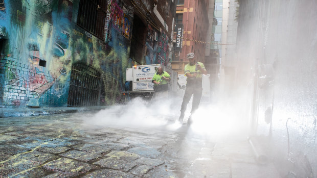 Cleaning in Melbourne's Hosier Lane, where masked killjoys paint-bombed popular street art.