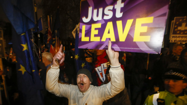 A pro-Brexit protester shouts slogans outside the Houses of Parliament.