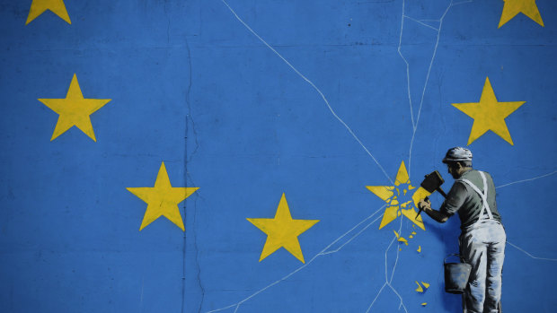 A mural by street artist Banksy near the Dover ferry port shows an EU star being chiselled away from the flag.