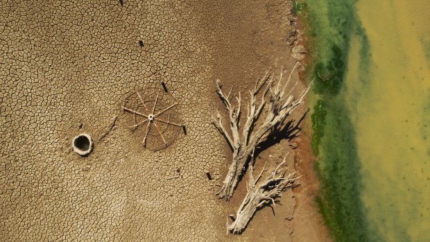 Lake Burrendong, one of the largest dams in the Murray-Darling Basin, nears being empty of water, revealing the remains of a farmhouse that would normally be under tens of metres of water.