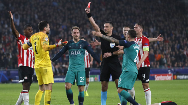 Tottenham goalkeeper Hugo Lloris is shown a red card.