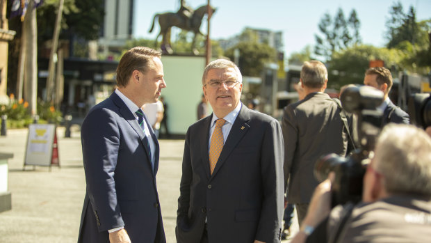 Dr Bach (centre) and Cr Schrinner are seen taking a quick tour outside the Brisbane City Hall.