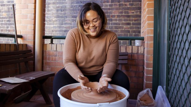Allyson Alfonso has a pottery wheel set up on her balcony in the inner-city suburb of Waterloo and is taking an online pottery course.