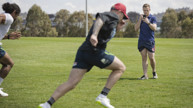 Andrew Heffernan keeps an eye on rugby league stars Blake Austin and Sia Soliola.