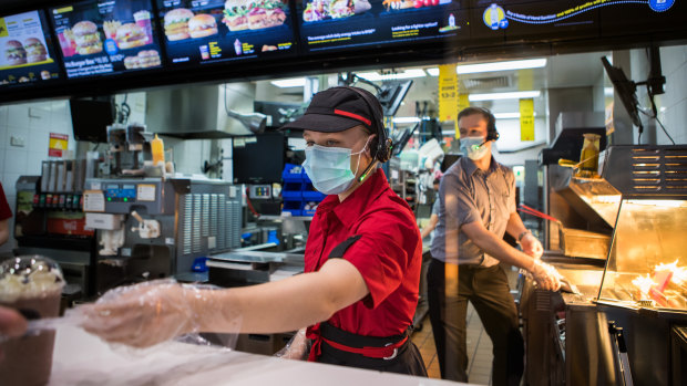 Staff at McDonald's in Boronia wearing masks on Tuesday.