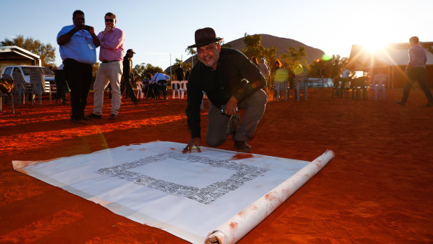 Noel Pearson signs the Uluru Statement from the Heart in May 2017. 
