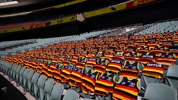 Crowded out: The absent Crows cheer squad marked their patch prior to the 2020 round 1 match against the Sydney Swans at an empty Adelaide Oval.