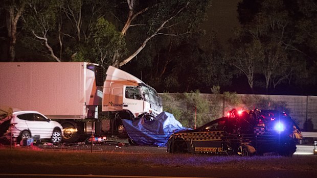 A damaged highway patrol police vehicle is pictured at the scene of the crash.