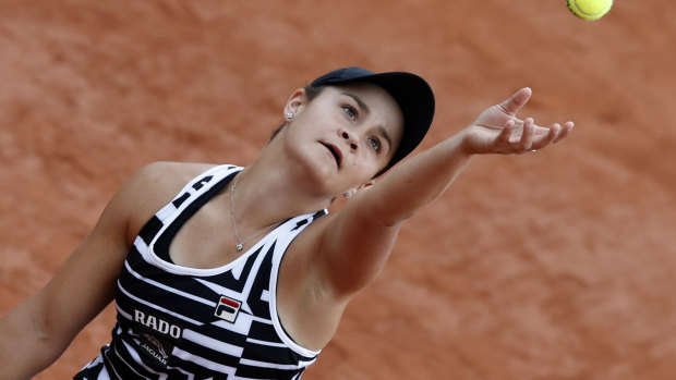 On a roll: Ash Barty prepares to serve in her French Open encounter with American Danielle Collins.