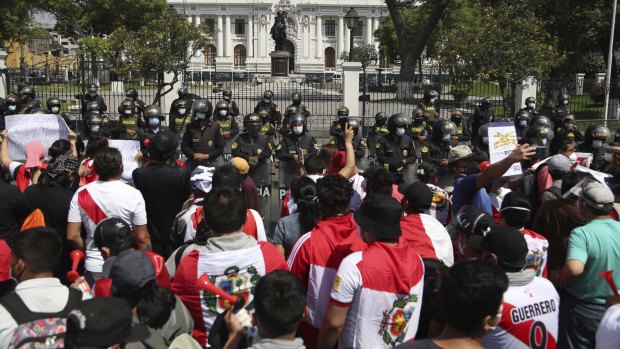 Protesters against the removal of President Martin Vizcarra gather in front of the Congress building in Lima, Peru.