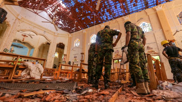 Soldiers inspect the damage inside St. Sebastian's Church in Negombo, Sri Lanka.