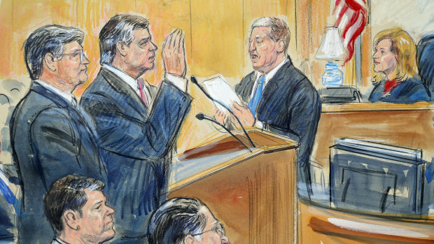 Courtroom sketch of former Donald Trump campaign chairman Paul Manafort, centre, and his defence lawyer Richard Westling, left, before District Judge Amy Berman Jackson, seated upper right, in Washington on Friday.