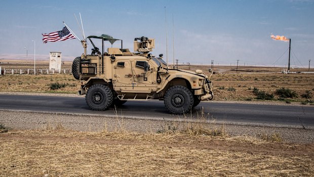 Some to remain: US forces patrol oil fields in eastern Syria.