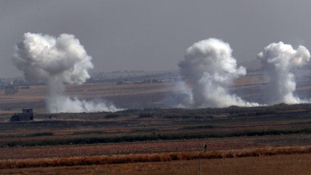 Smoke billows from targets inside Syria during bombardment by Turkish forces on Thursday.