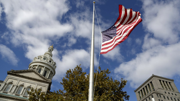 A United States flag is seeing flying at half staff.