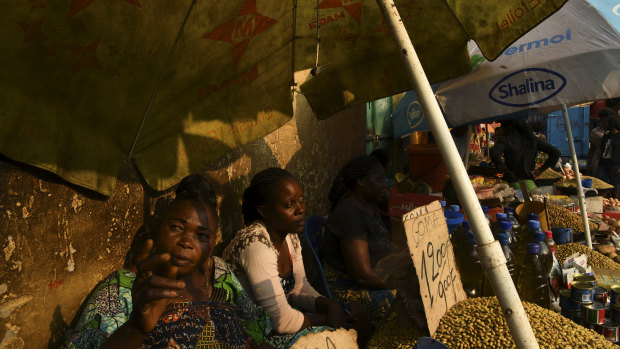 Women selling beans at their market stands on the streets of the Democratic Republic of Congo’s capital Kinshasa. 