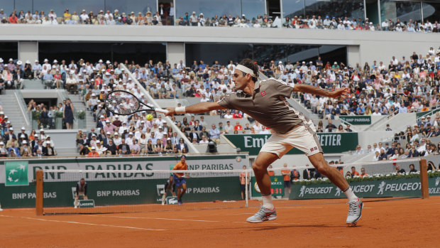 Roger Federer at full stretch in his opening match at the French Open.
