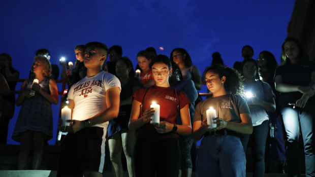 Mourners attend a vigil for victims of the deadly shooting that occurred earlier in the day at a shopping centre in El Paso, Texas. 