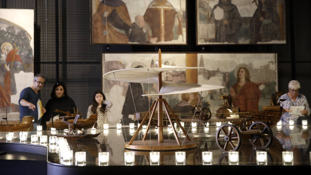 Visitors look at models based on the academic interpretation of the Italian Renaissance painter, scientist and inventor at the National Museum of Science and Technology, Milan.