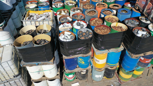 A stockpile of steel drums suspected to contain airbag detonators.