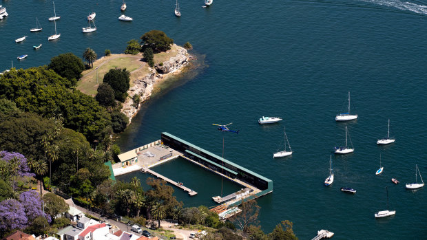 A helicopter helps install the lighting at the newly renovated Dawn Fraser Baths on Sydney Harbour in Balmain.