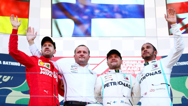 Pride of place: Top three finishers Valtteri Bottas of Finland (second from right), Sebastian Vettel of Germany (far left), Lewis Hamilton of Great Britain (far right).