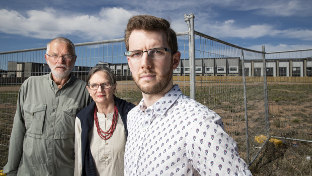 Local residents John and Alison Hutchison, and Ryan Hemsley standing in front of the site where 212 units are proposed. They are angered by a development proposal in Coombs that's larger than what was intended for the site when it was sold in February this year. 