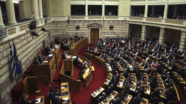 Tsipras delivers his speech during a the confidence-vote session.