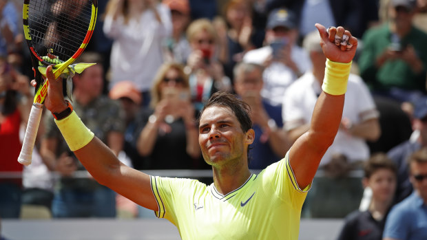 Shining star: Spain's Rafael Nadal celebrates winning his second round match of the French Open tennis tournament against Germany's Yannick Maden.