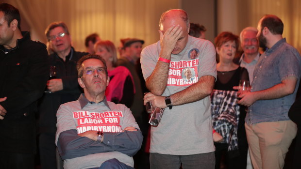 Labor supporters can't hide their disappointment as results come in on Saturday night. 