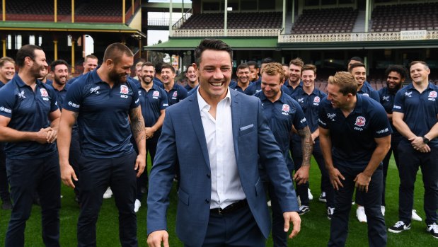Team man: Cooper Cronk with his Roosters teammates after announcing he will retire at the end of the season.