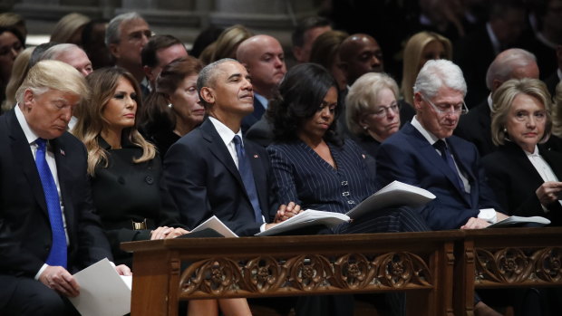 Small talk among the former presidents stopped once the Trumps arrived.